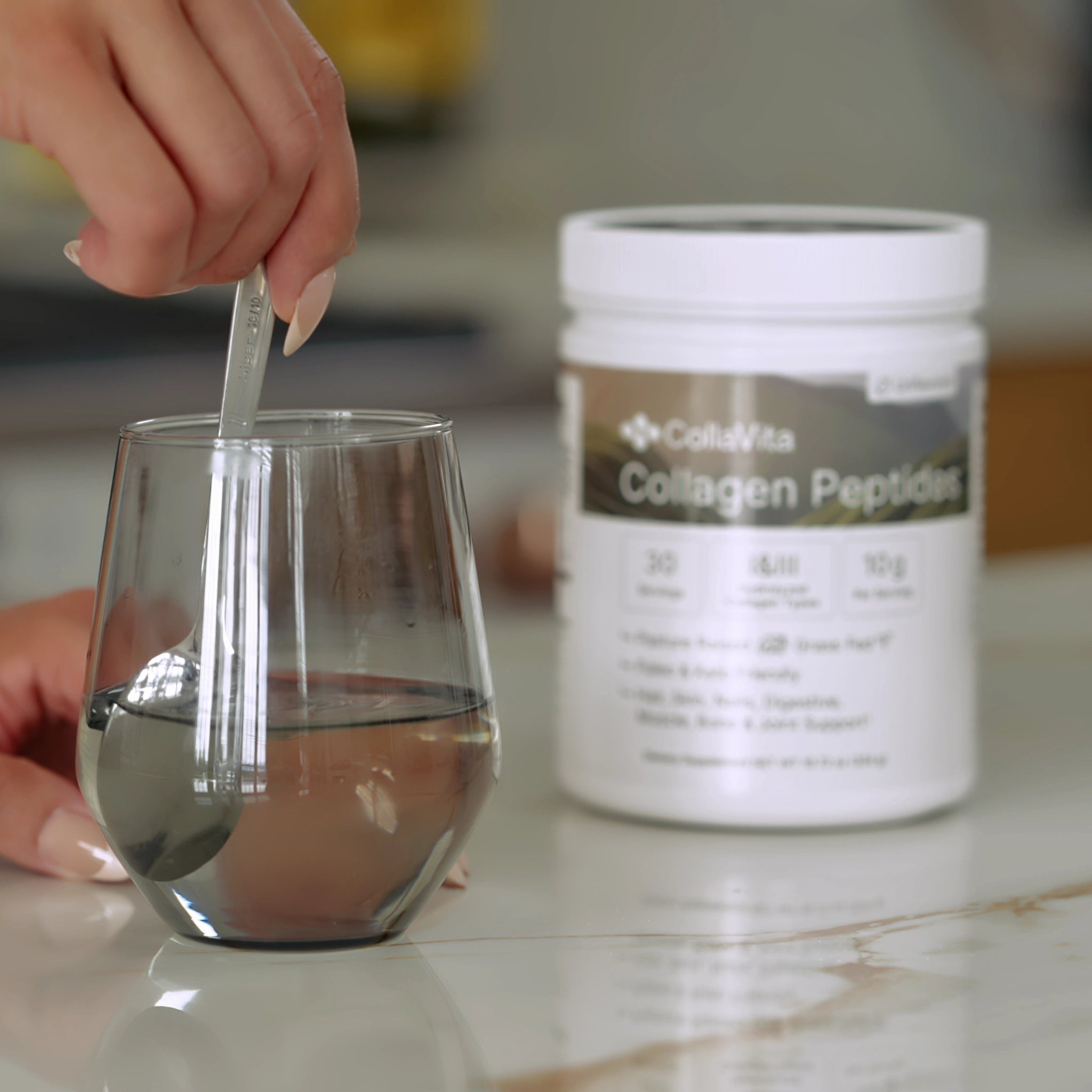 Preparing CollaVita Collagen Peptides in water, unflavored supplement for skin, joints, and hair.